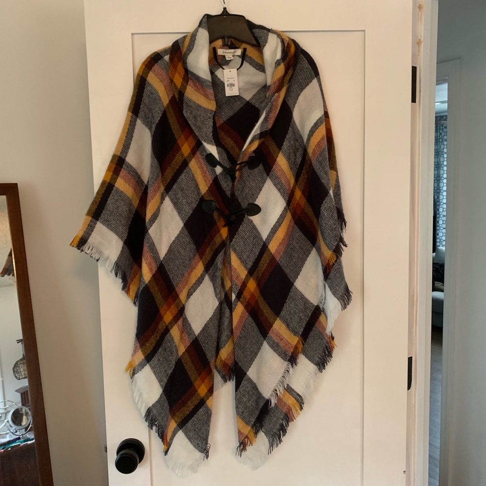 Plaid cape with tooth button detail